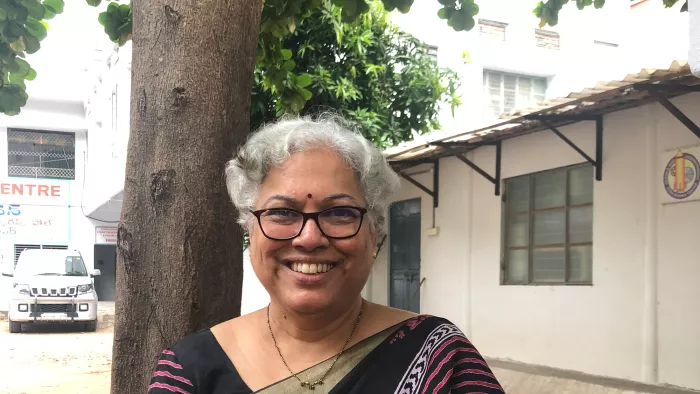 Woman in front of a building