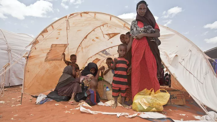 Women and children in a tent