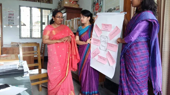 Women showing a chart