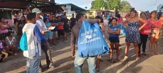 Food and hygiene kits being distributed among the community members in Maripa