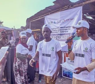 people speaking at a peace concert