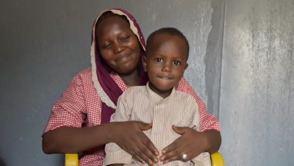 A woman with a child smiling