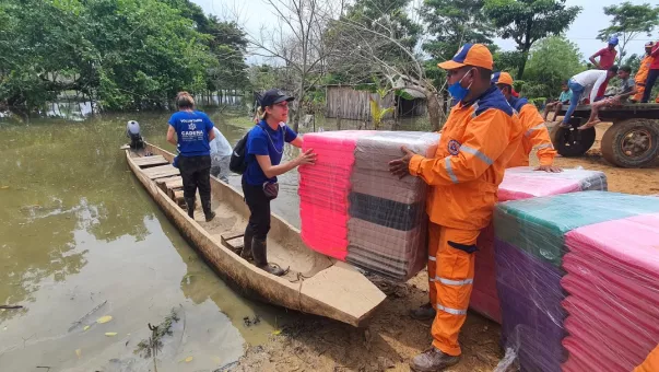 People with kits on a boat