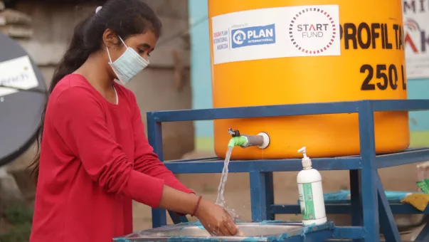 Girl washing her hands