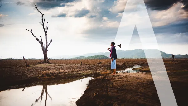 Man in a post flood landscape